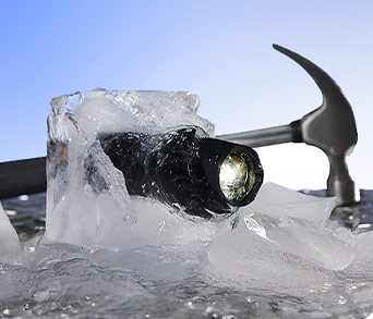 Tac Light lit up while frozen in a block of ice